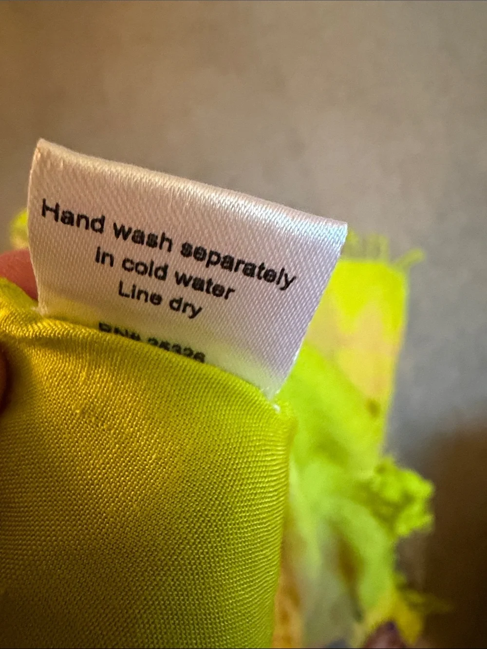 World market Sarong in pink and light chartreuse  with long tassels at ends